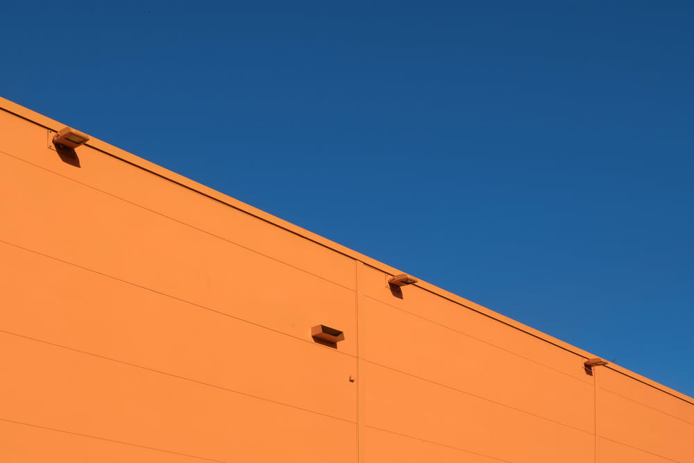 architectural photography of orange concrete structure