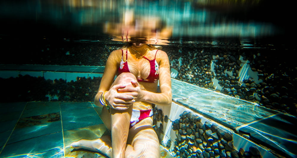 woman sitting underwater