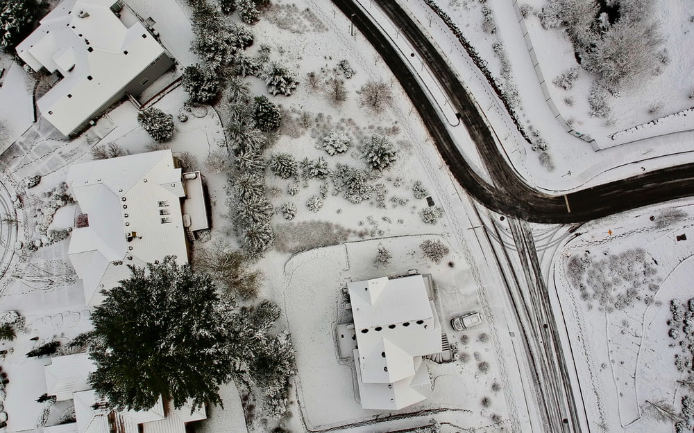 aerial photography of houses coated with snow