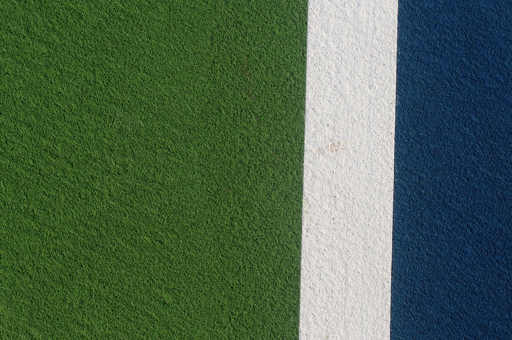 a close up of a green and blue wall