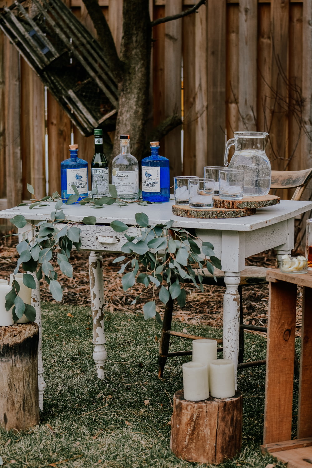 white wooden table with bottles on top