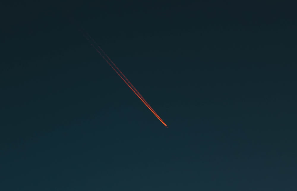 red smoke coming from plane
