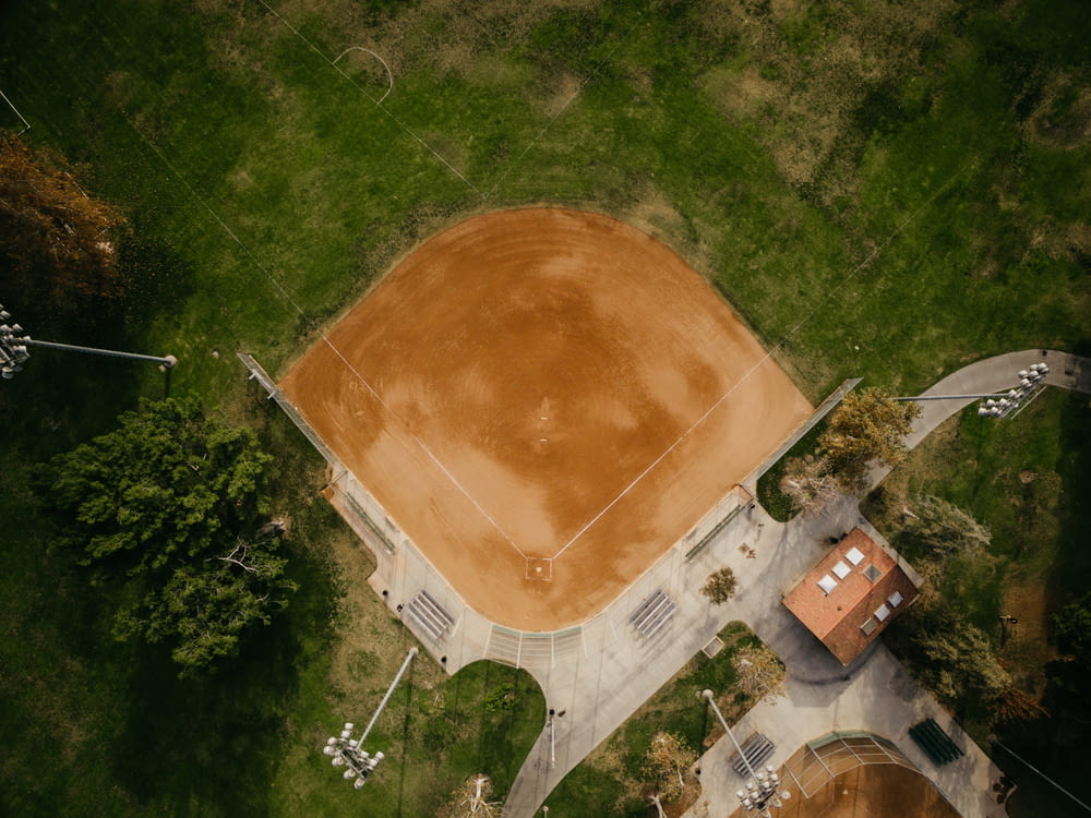 aerial photography of brown baseball field surrounded green field