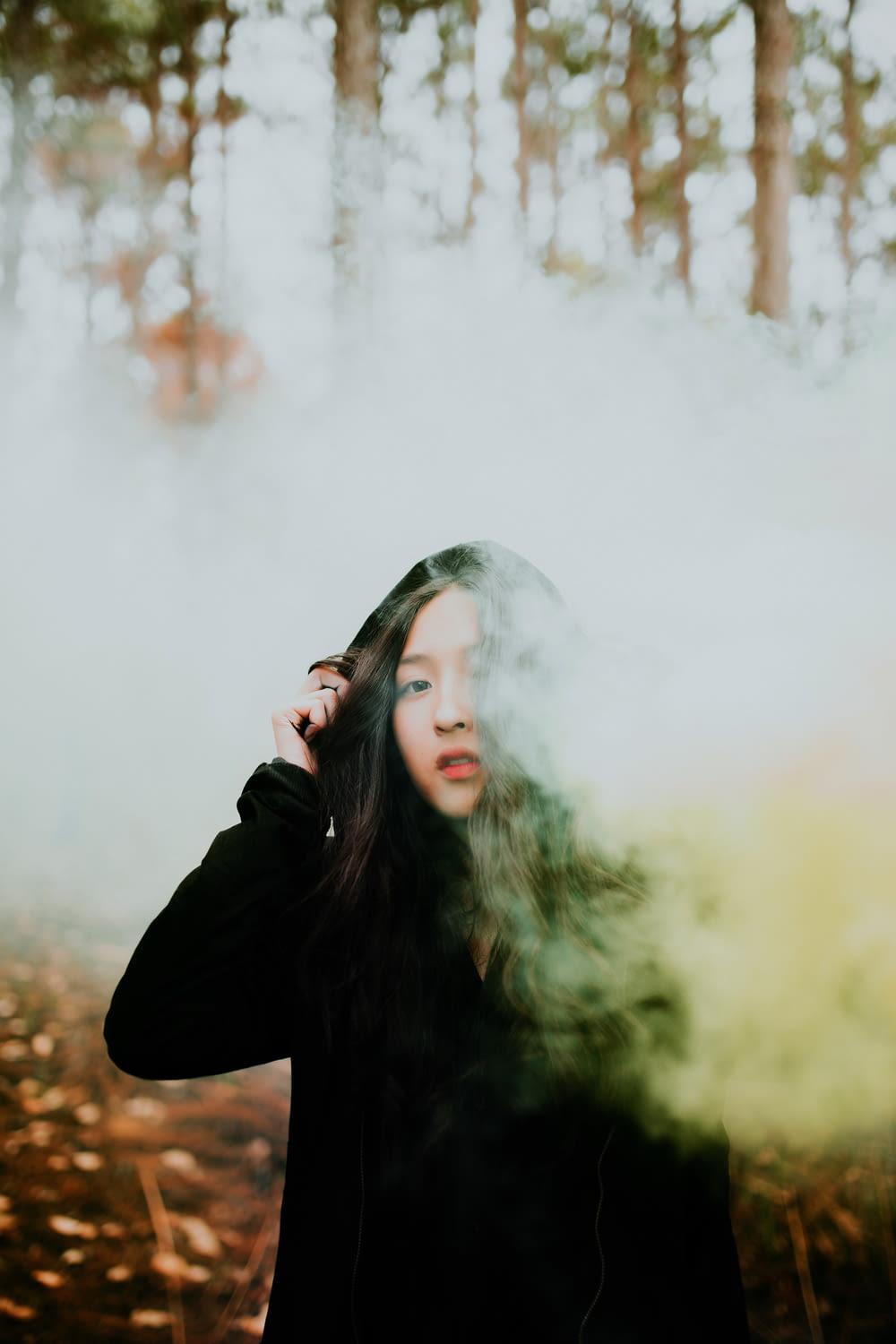 woman surrounded by smoke