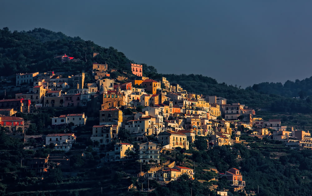 low-angle photography of town on mountain