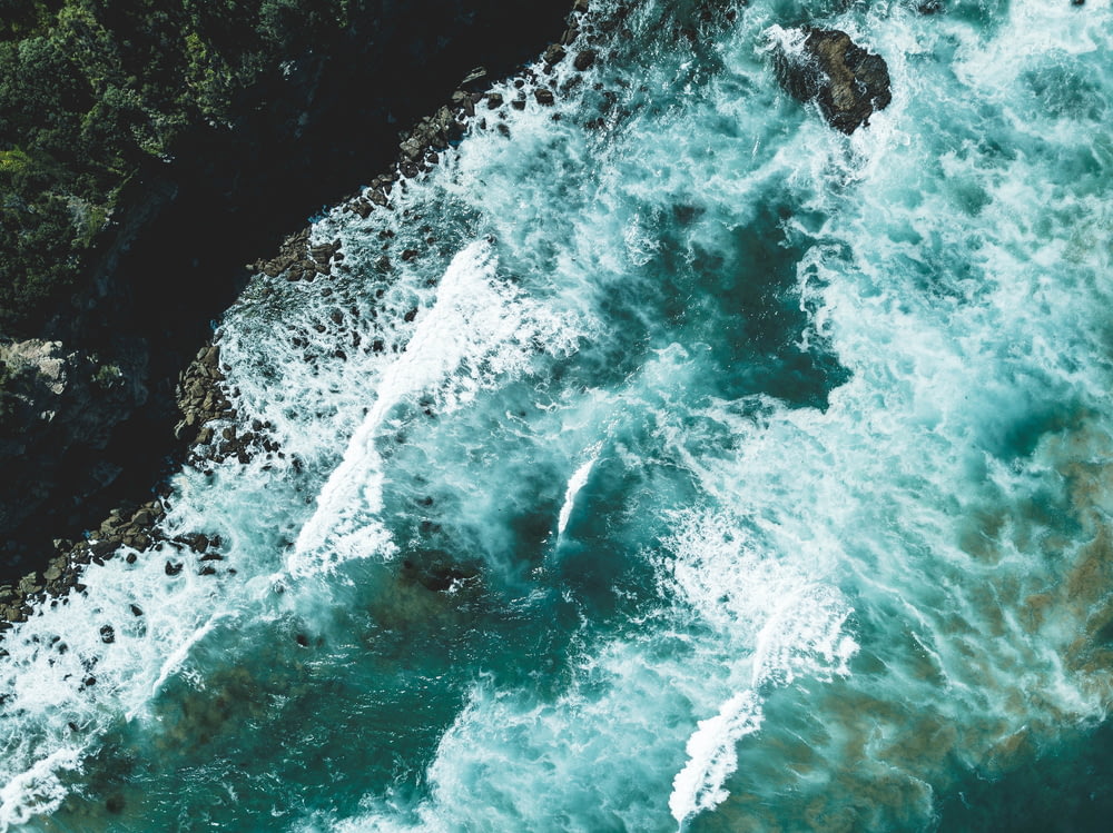 aerial view photography of ocean waves during daytime