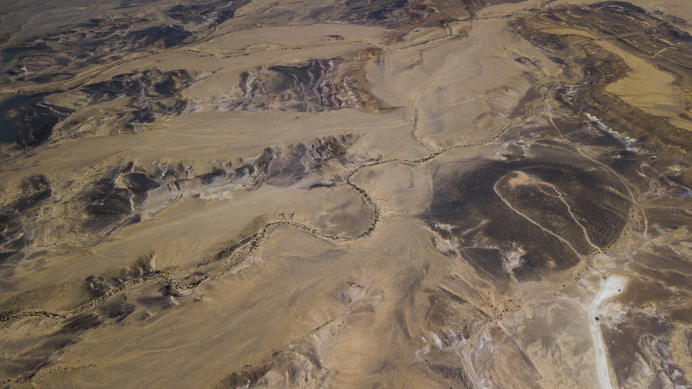 aerial photo of brown mountains during daytime