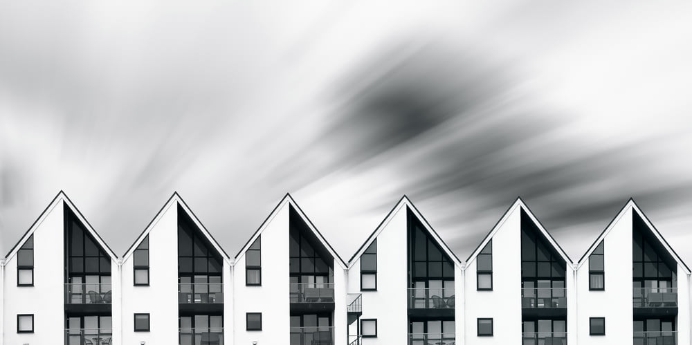 a row of white buildings sitting next to each other