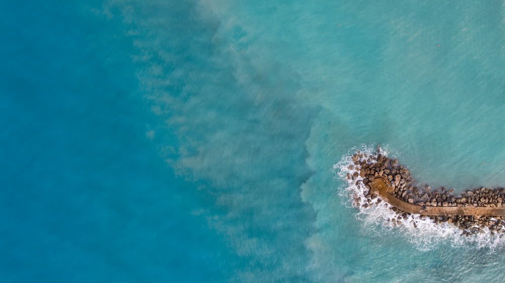 aerial photography of islet during daytime