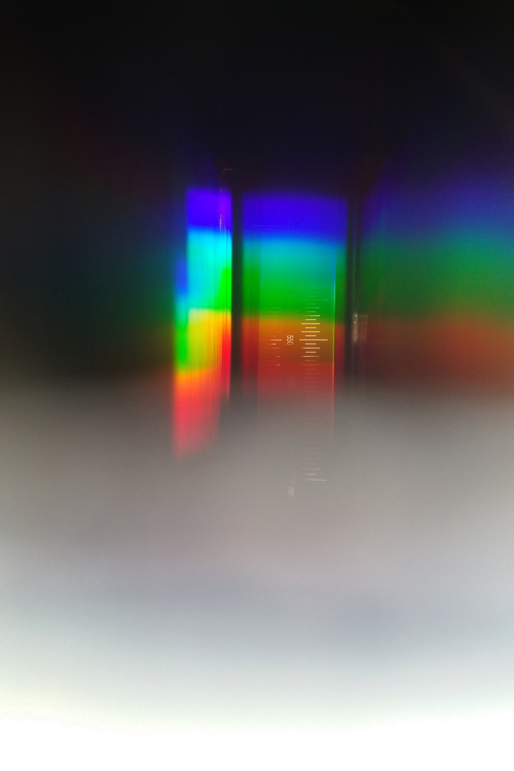 a blurry photo of a cell phone with a colorful screen