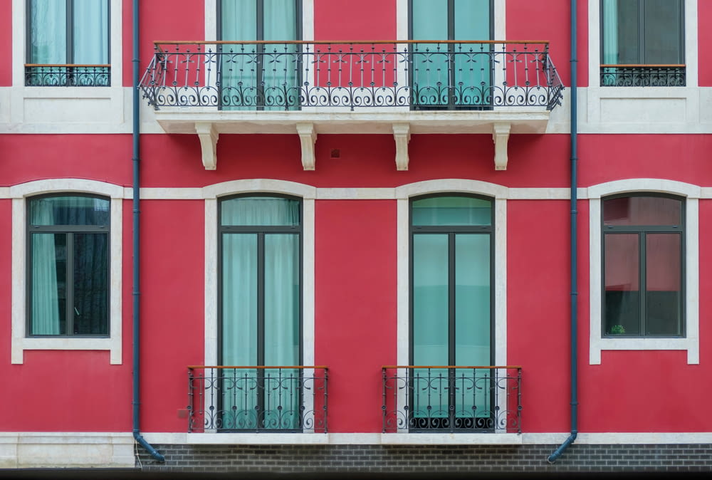red and white house with balcony