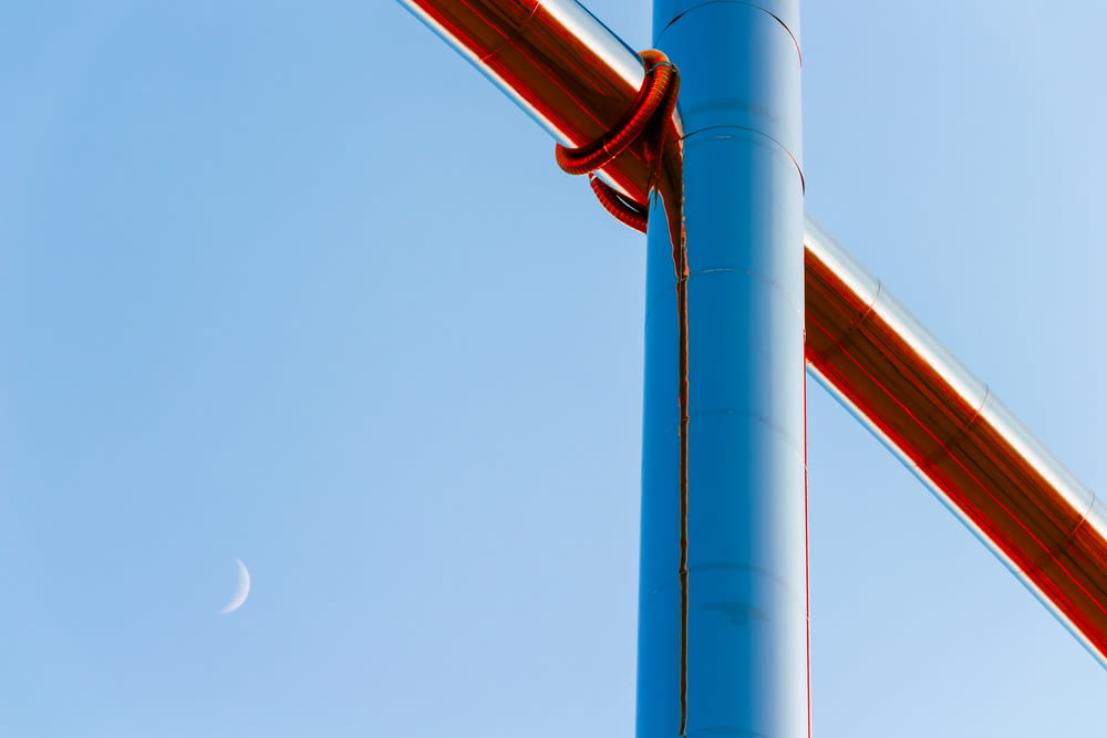 a metal pole with a blue sky in the background