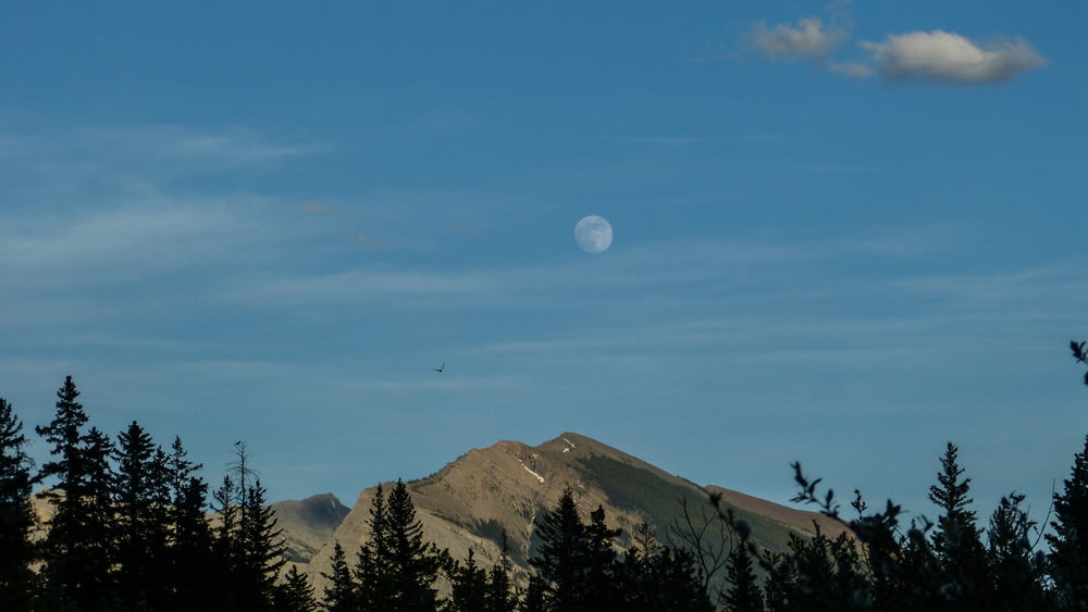 mountain under moon during daytime