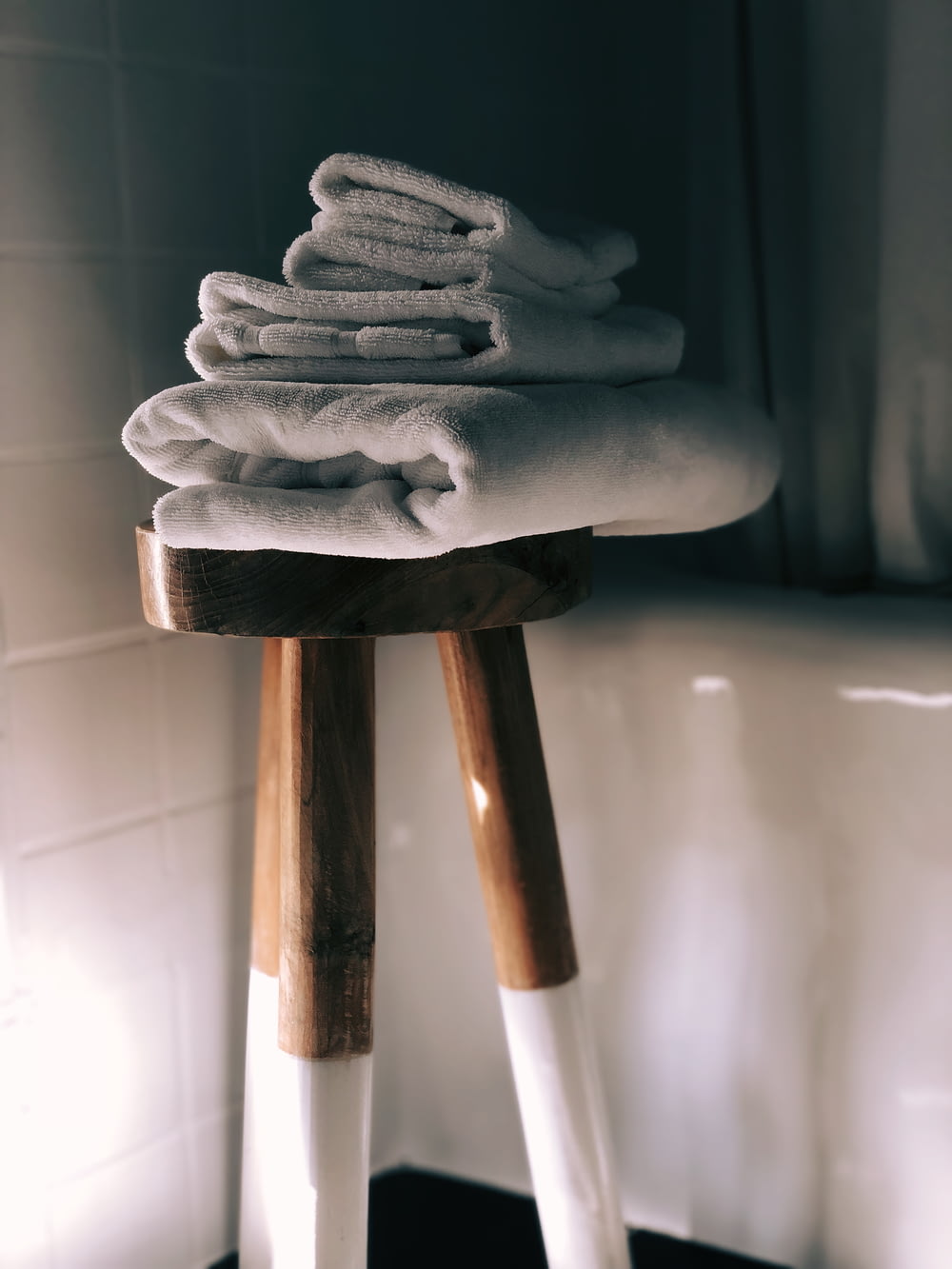 white towels on brown wooden stool