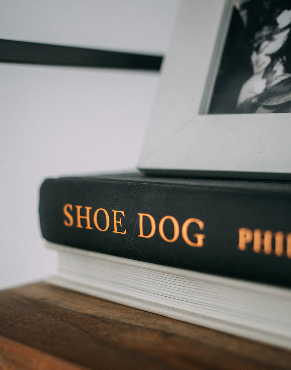 a pair of shoes sitting on top of a book
