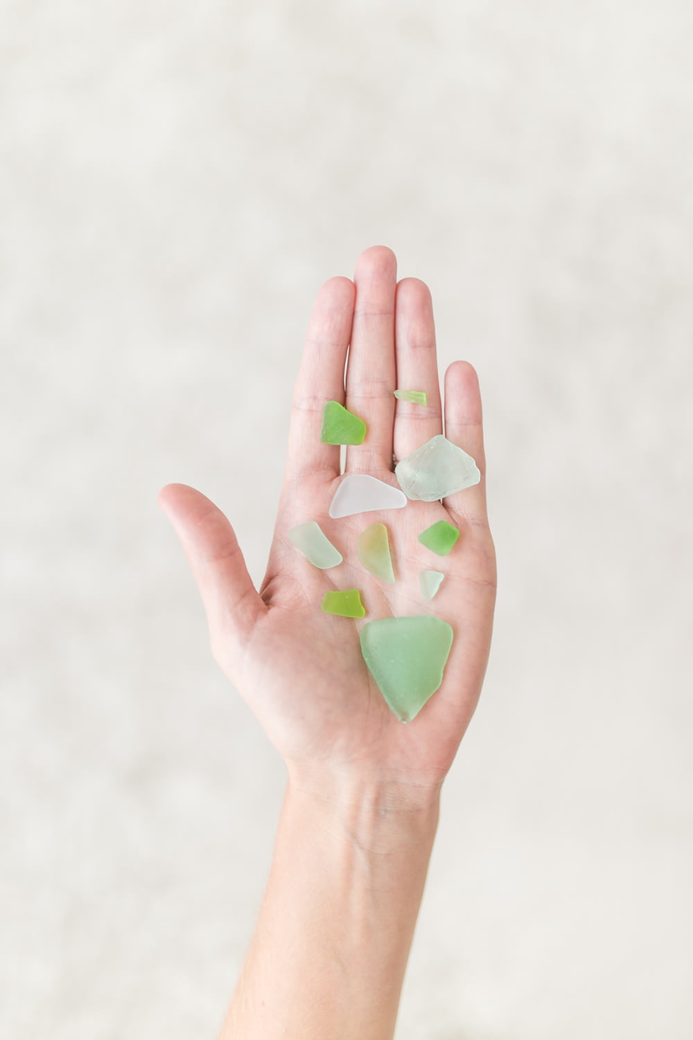 person holding green shards