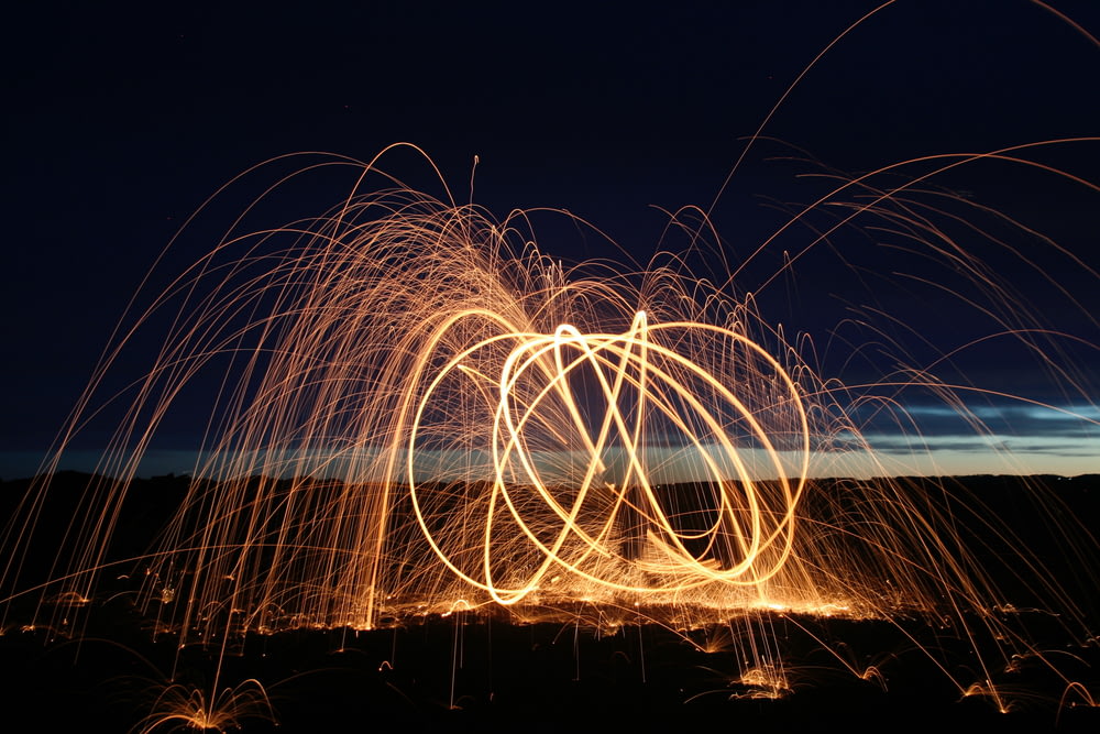 time-lapsed photography of a fire dancer