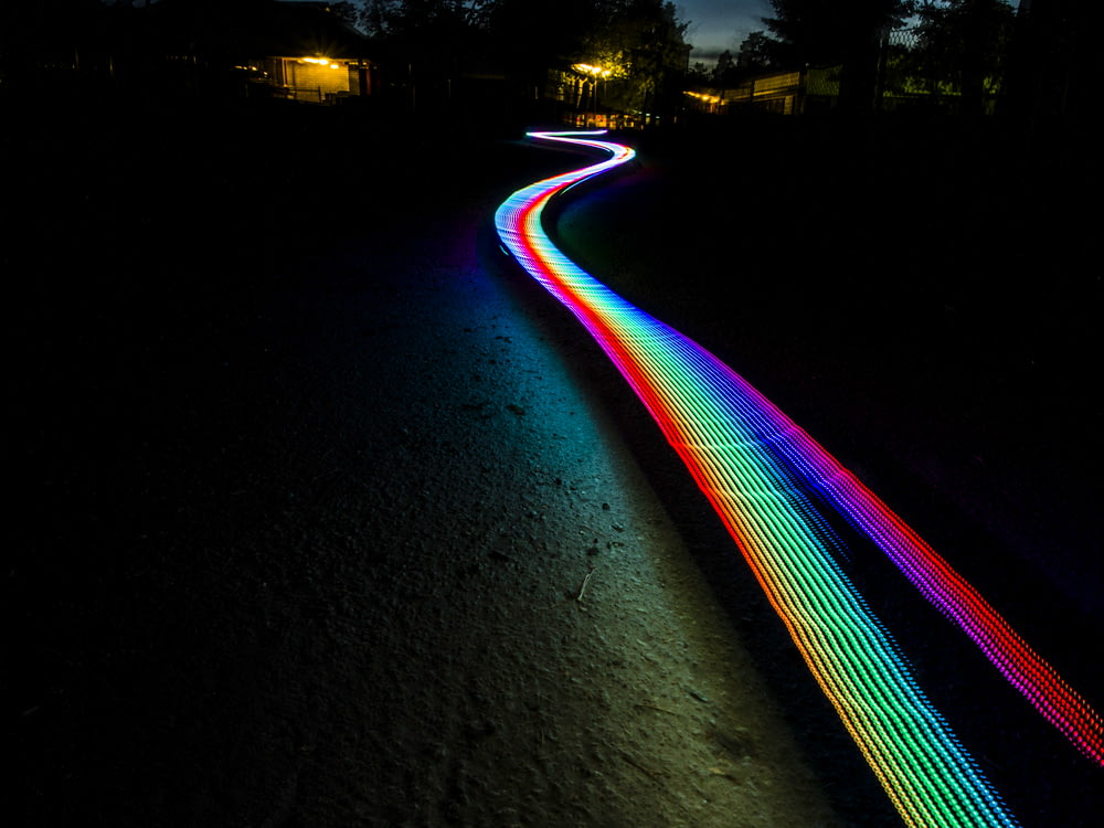 multicolored light passage in dark area