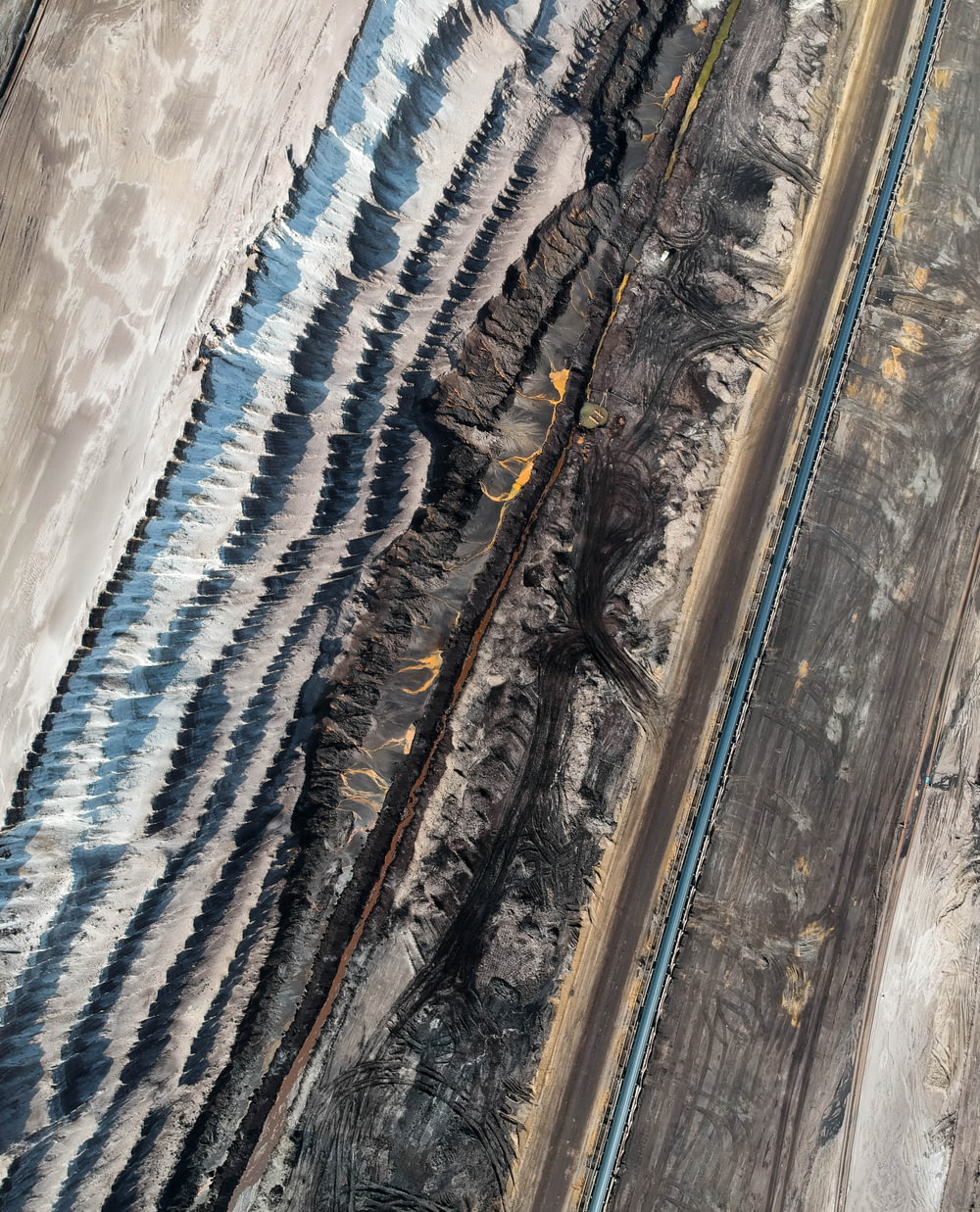 an aerial view of a train track in the desert