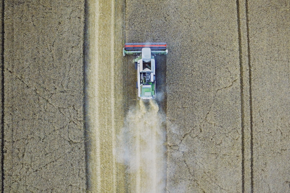 white tractor on gray field