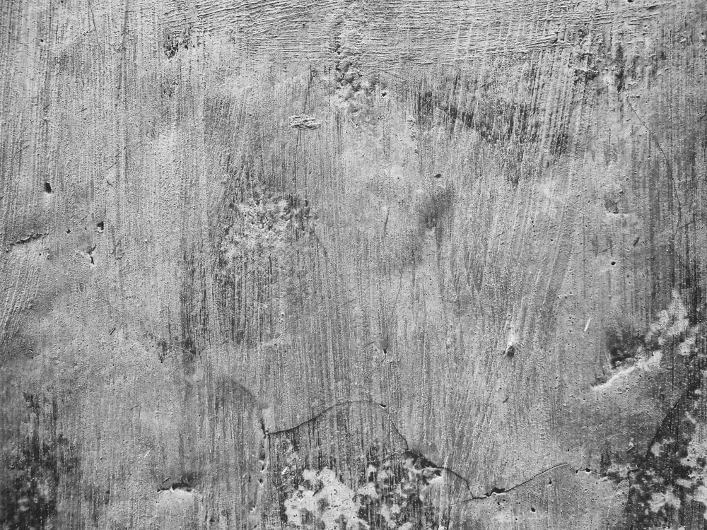 a black and white photo of a wooden surface
