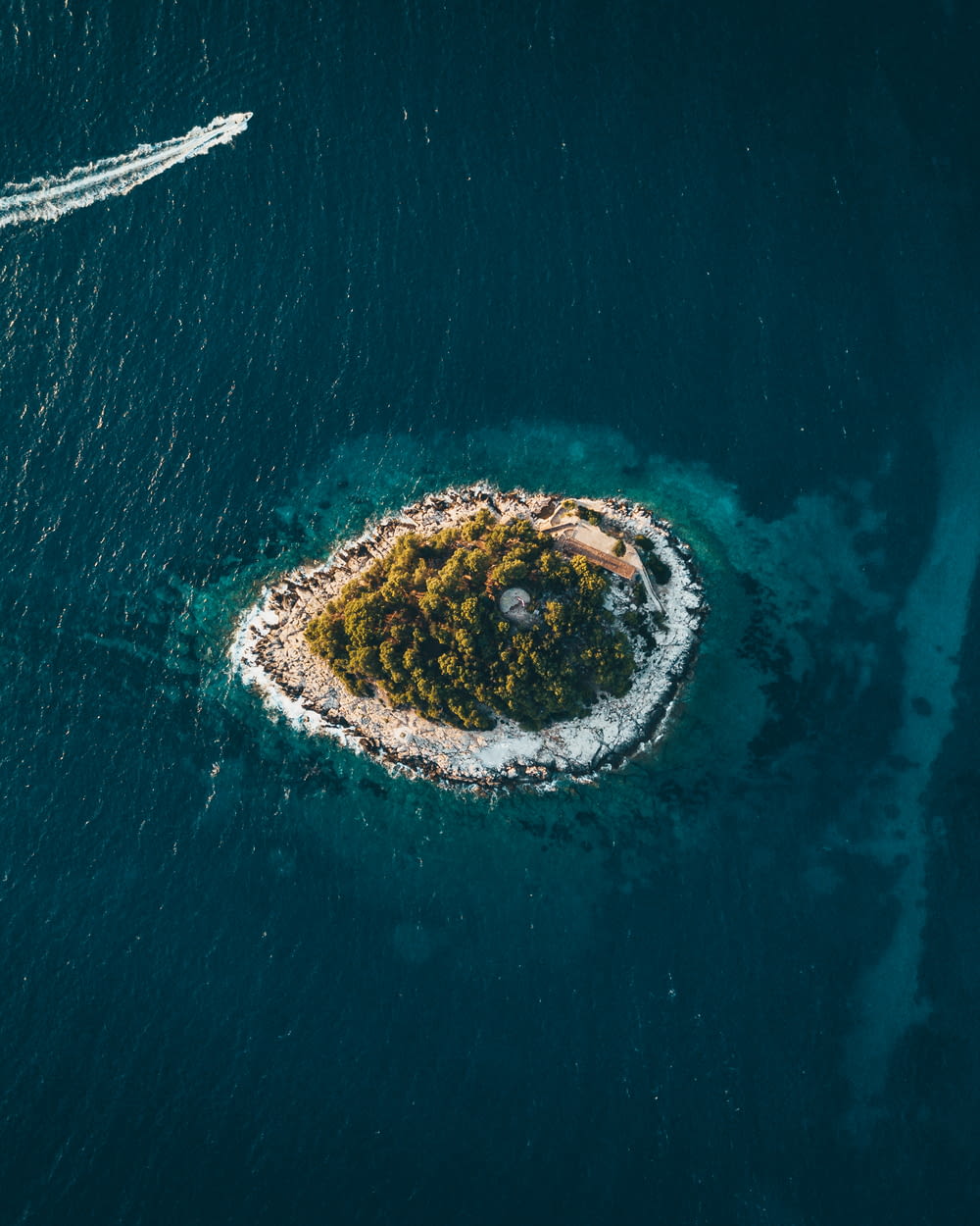 aerial photography of island surrounded by sea