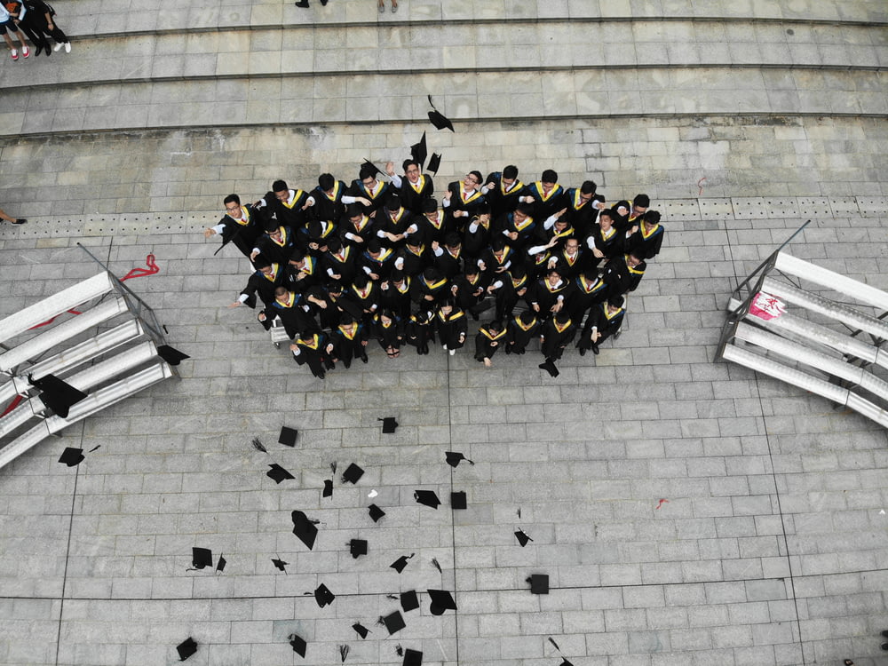 group of graduates throwing academic hats