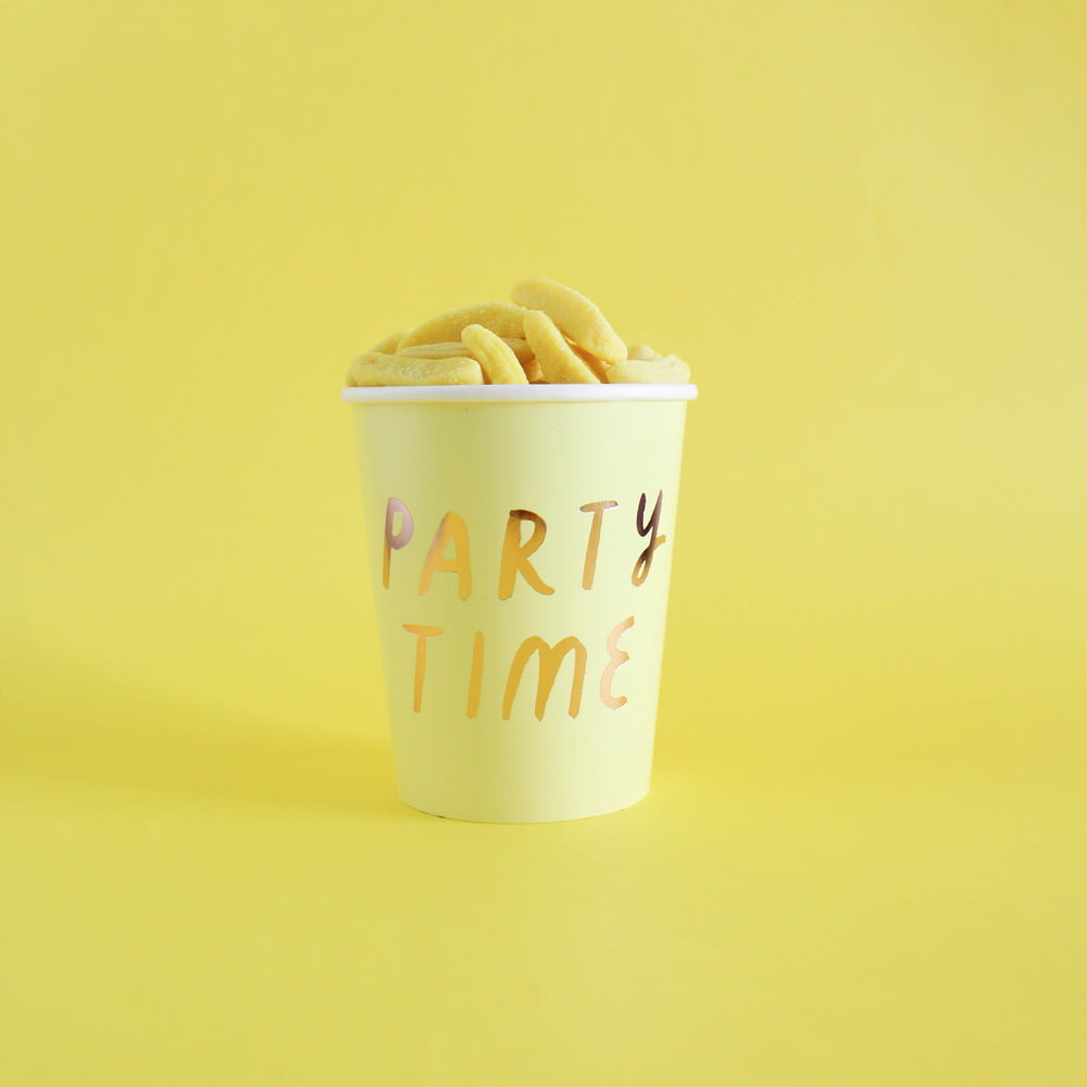 Party Time cup on yellow surface