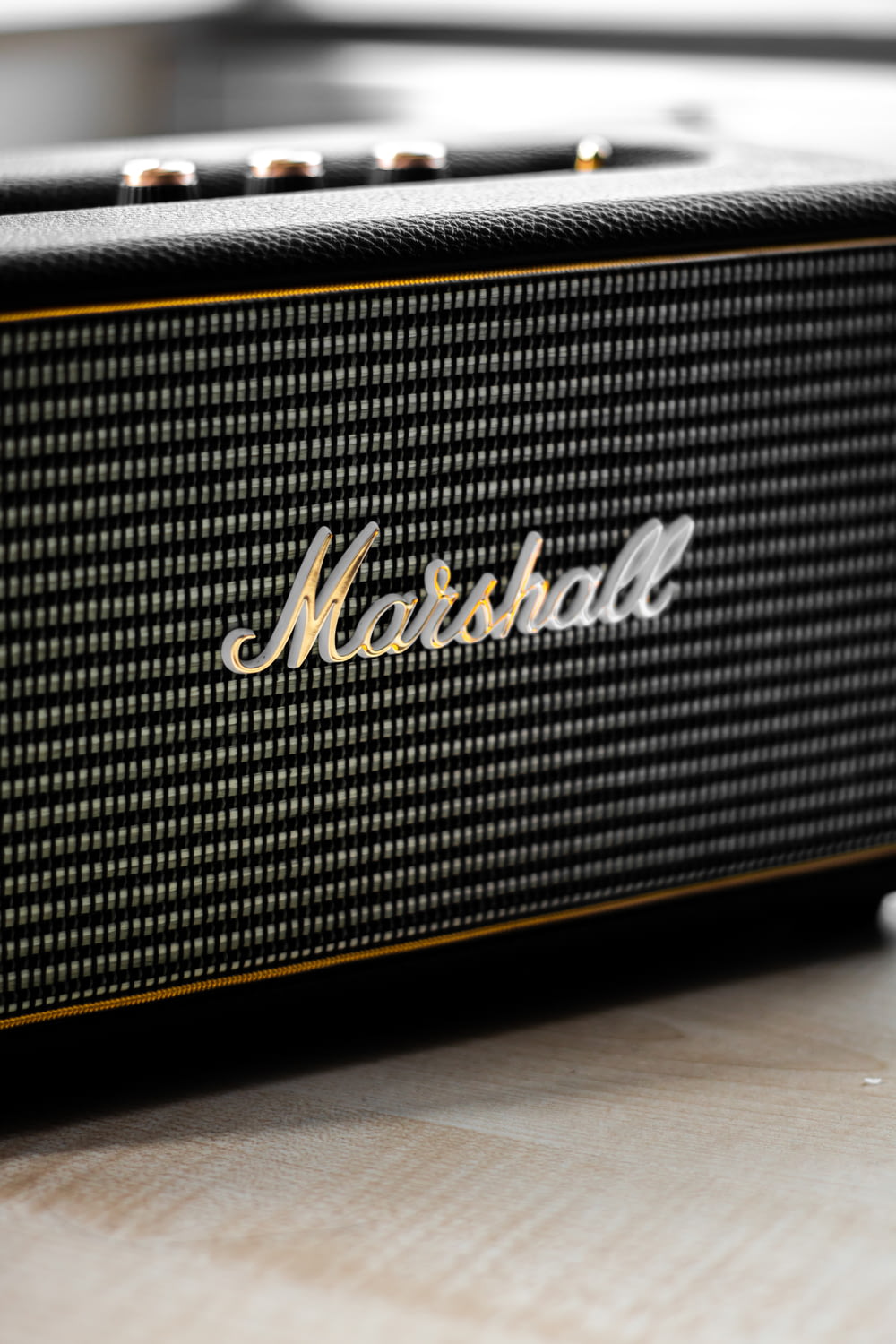 closeup photo of gray and black Marshall guitar amplifier