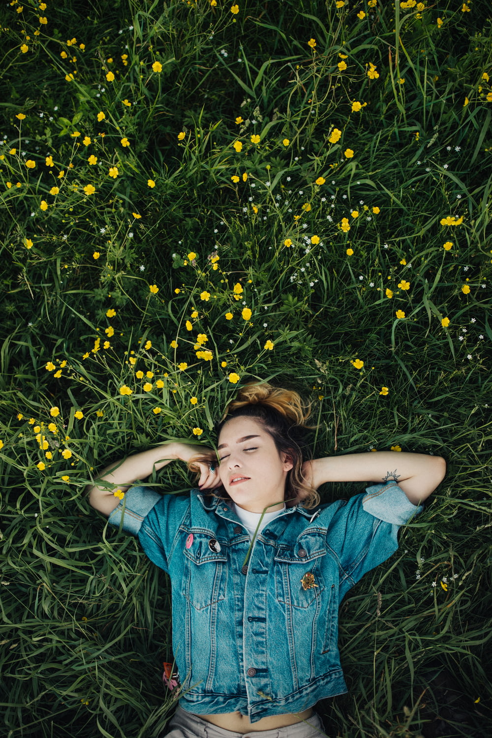 woman lying on grassland