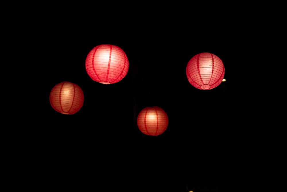 four red floating sky lanterns