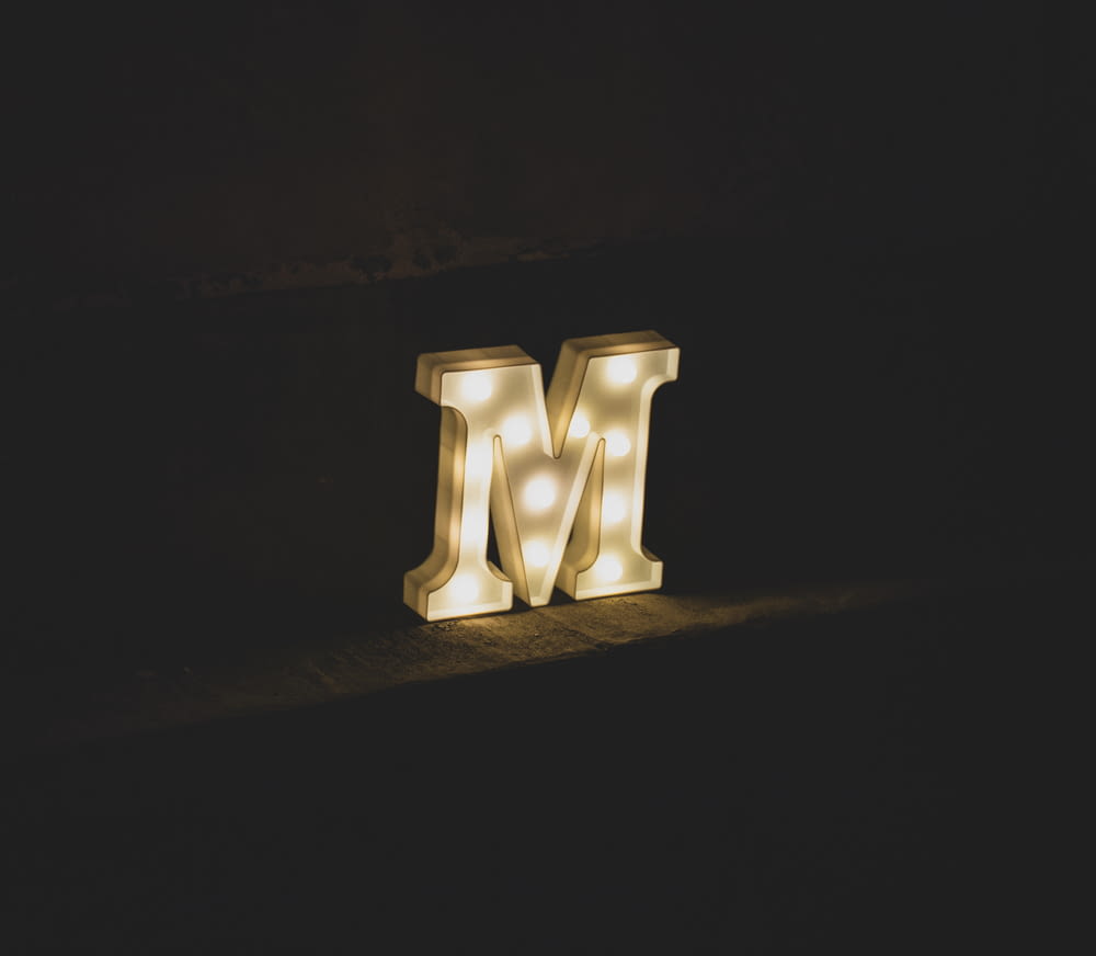 white M marquee letter signage