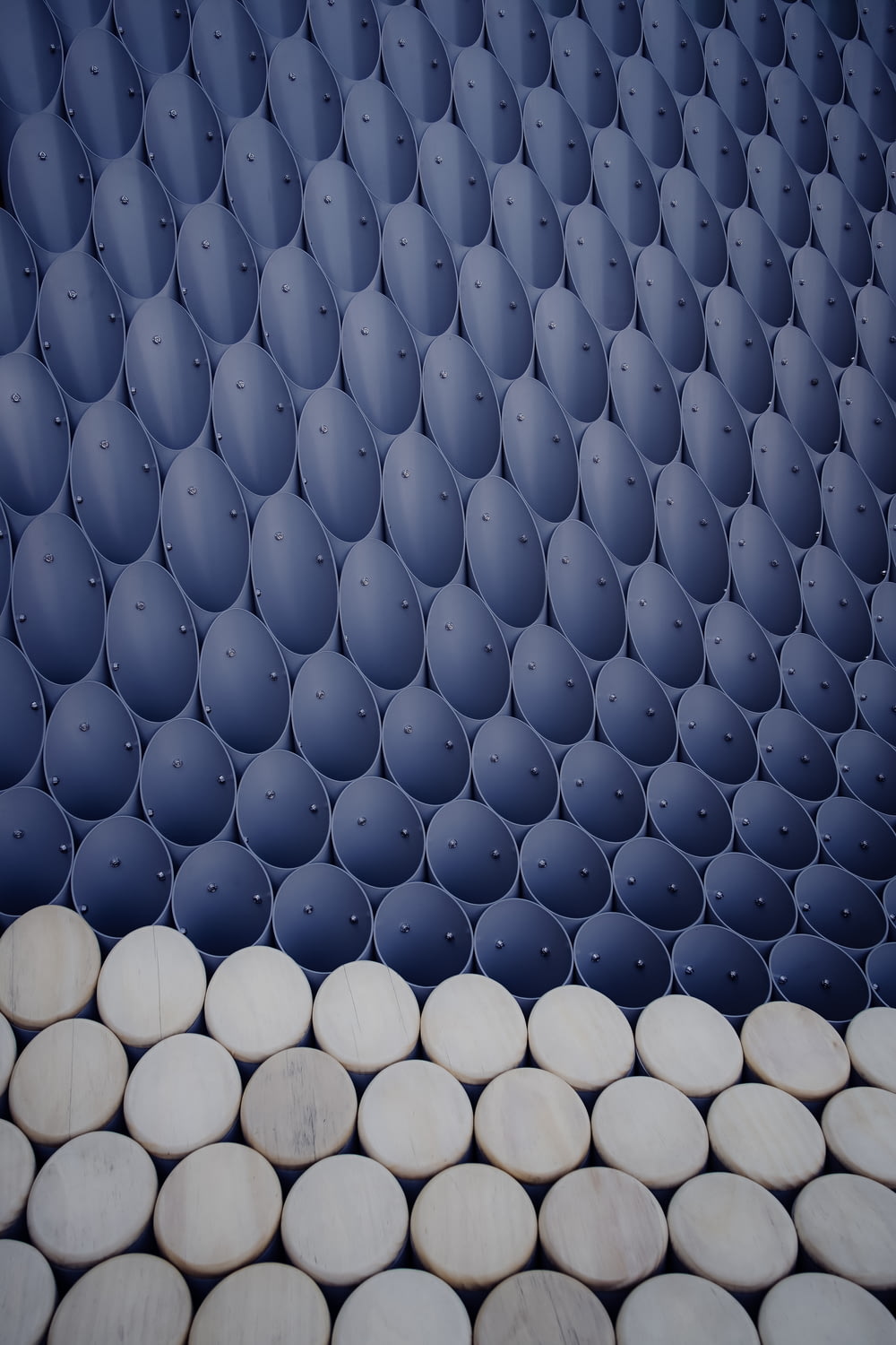 a wall made out of many round objects