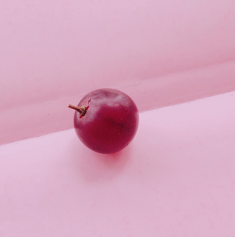 cherry fruit on pink textile