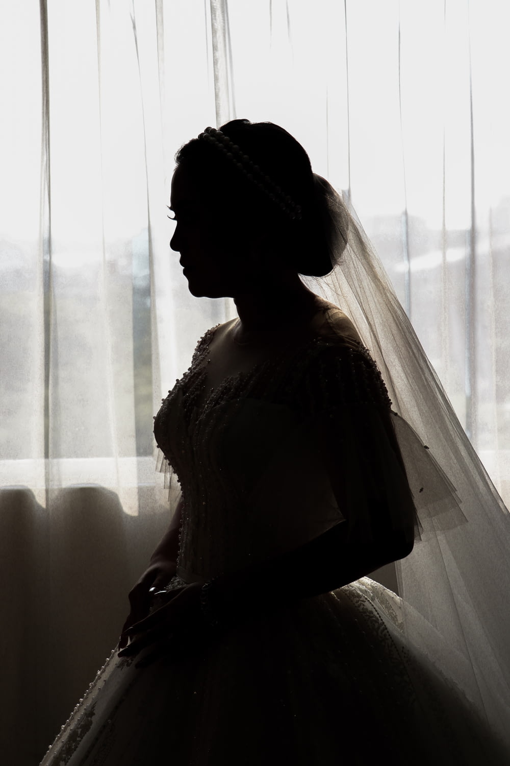 woman in white bridal gown and veil