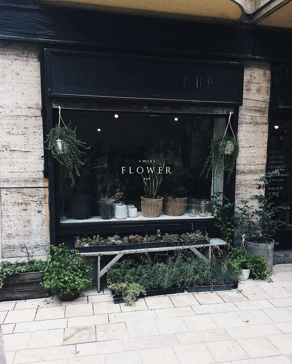 black wooden flower shop front