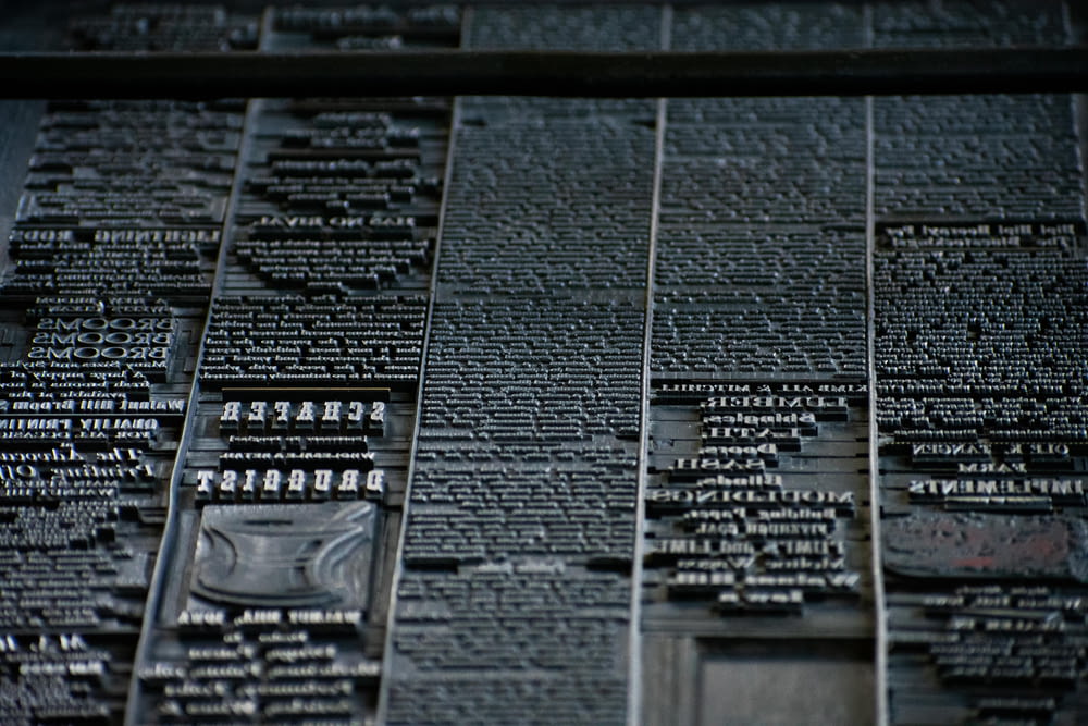 a close up of a wall with many names on it