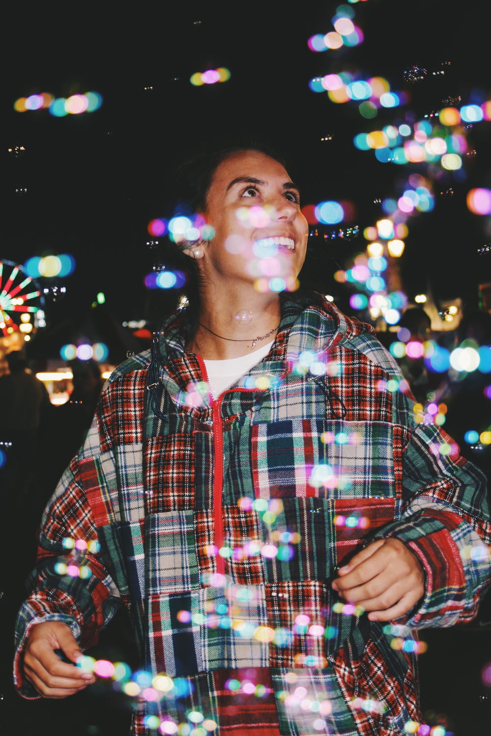 woman standing with bokeh lights background