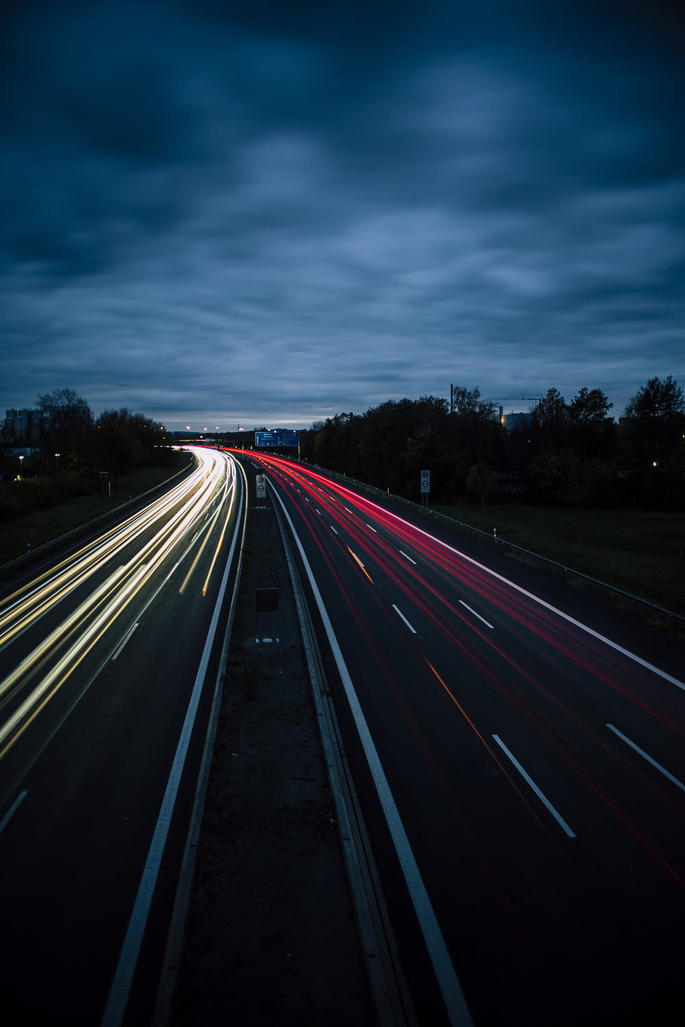 time-lapse photography of vehicle lights on road