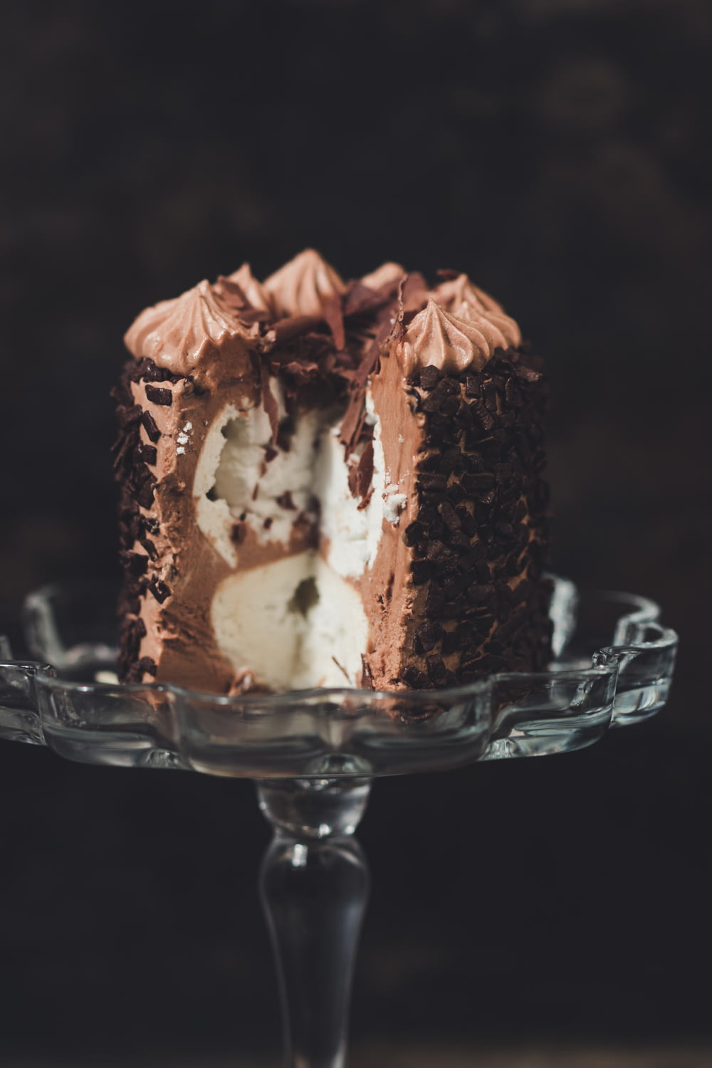 sliced chocolate vanilla cake on cake stand