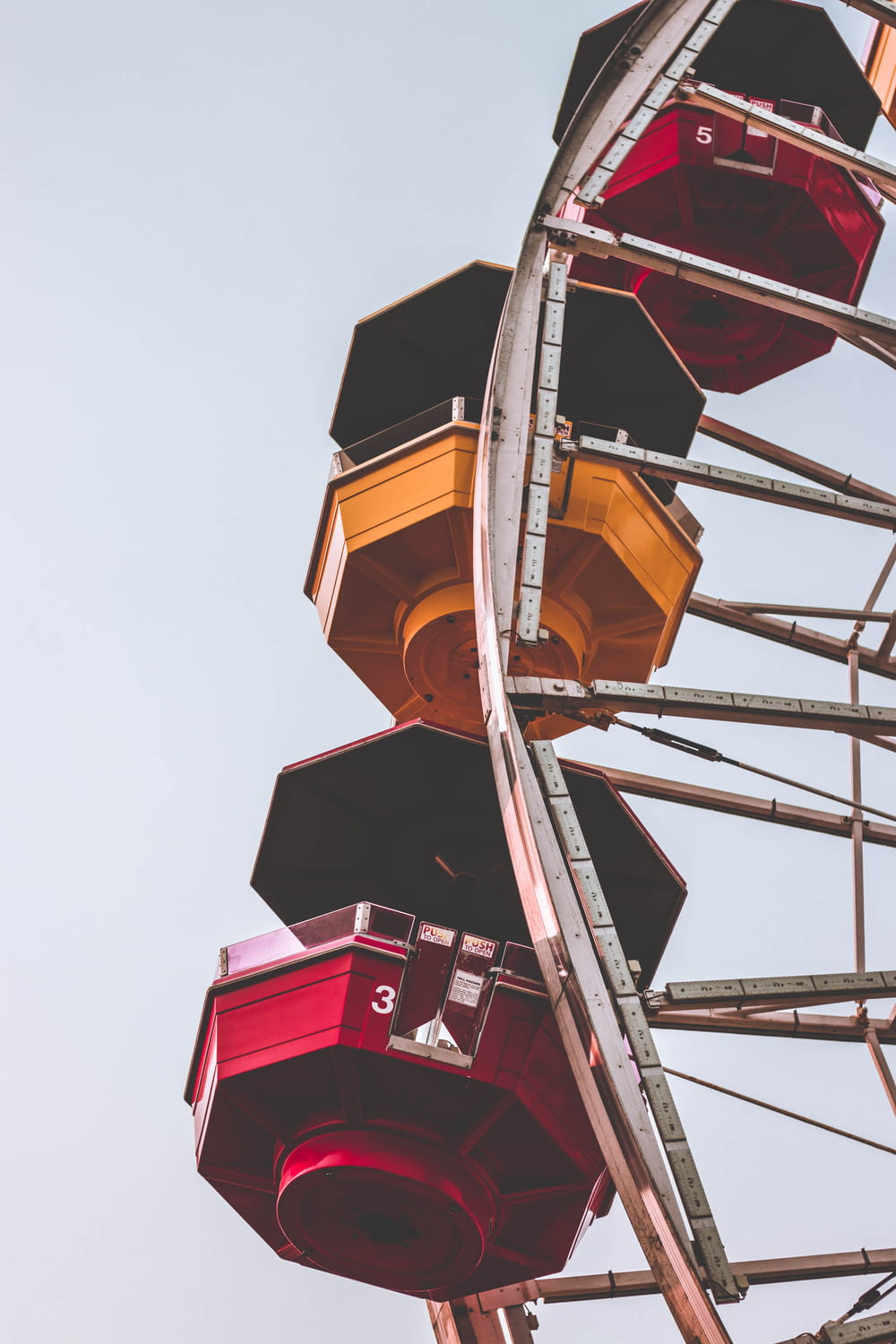 architectural photography of yellow, red, and white ferris wheel