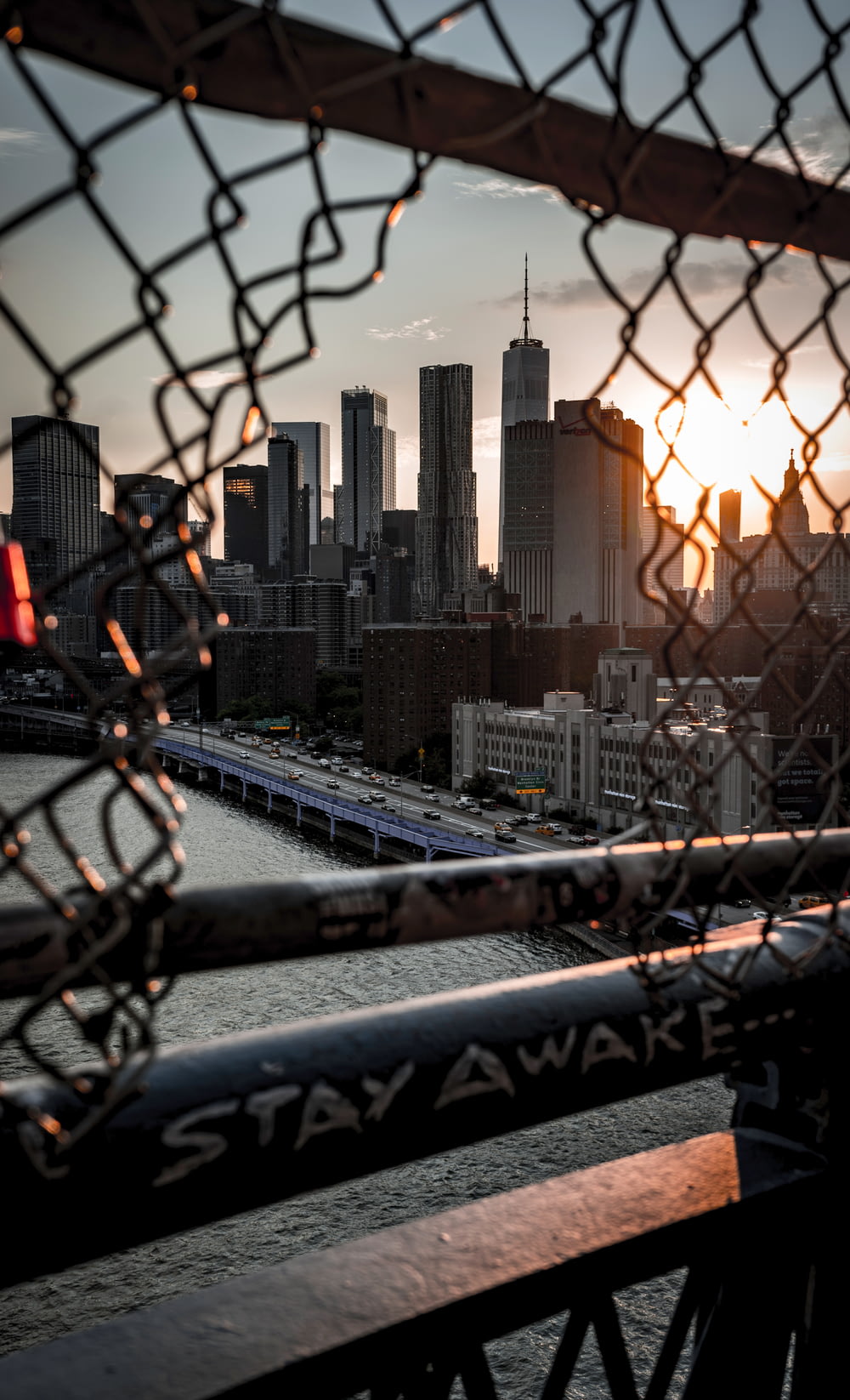 chain link fence overlooking high rise building