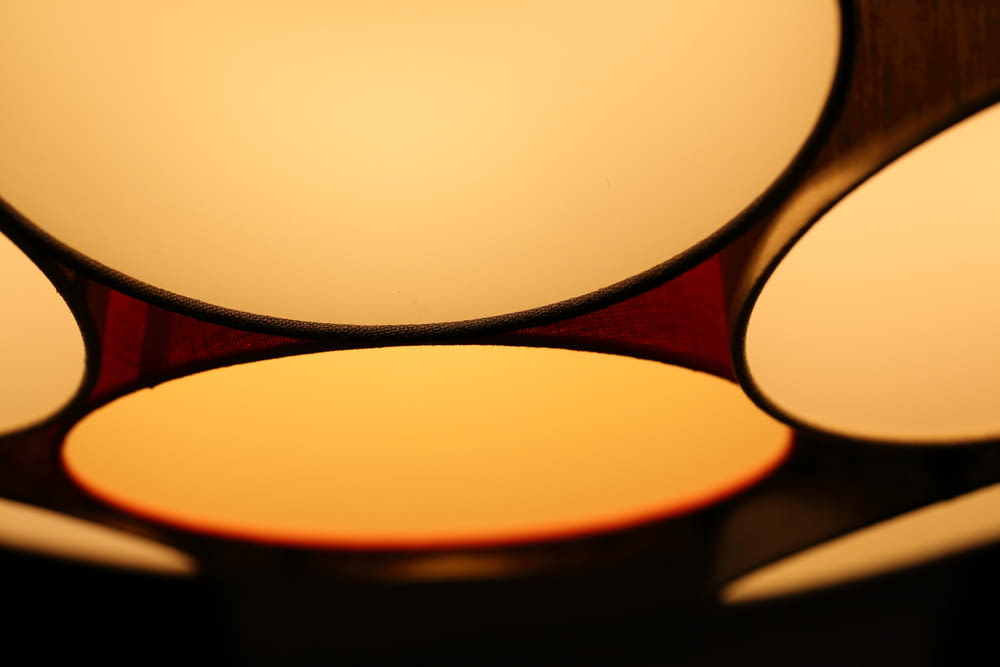 a close up of a light fixture with four lights