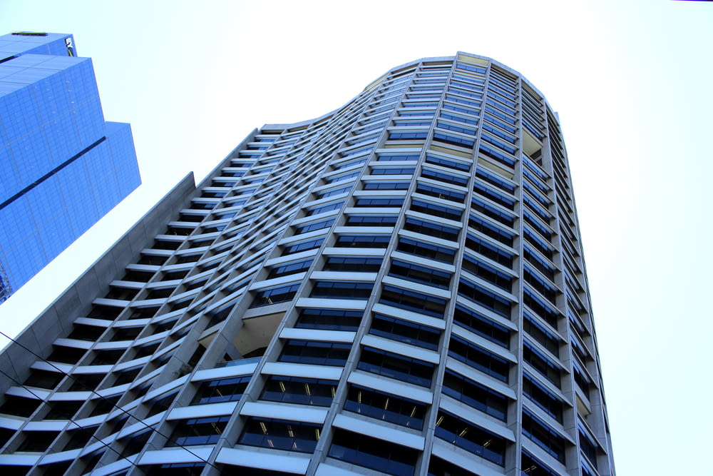 low angle photography of grey high rise building