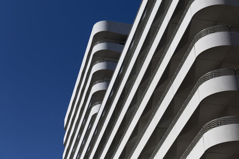 low-angle photography of white concrete building