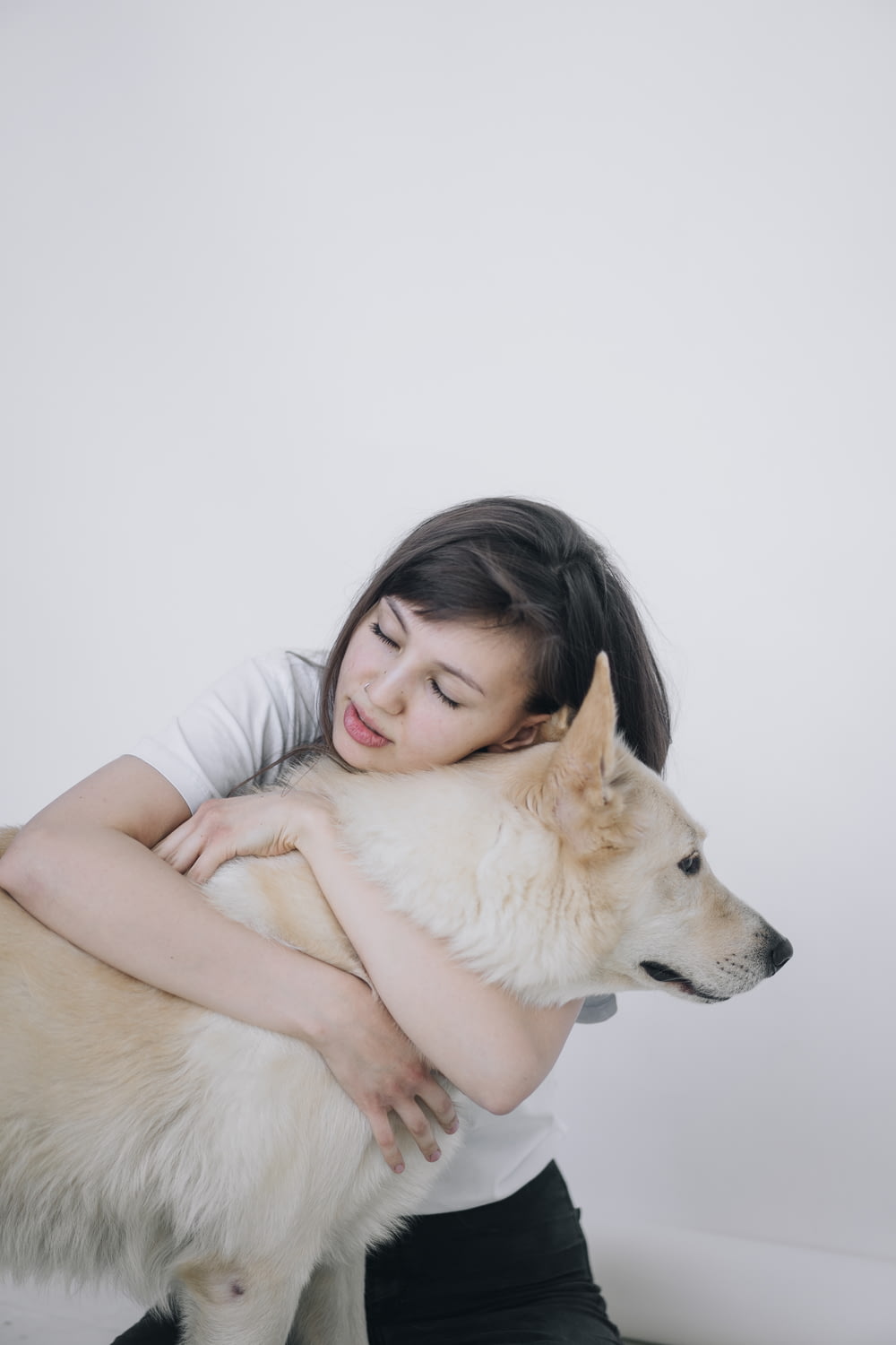 woman hugging a dog