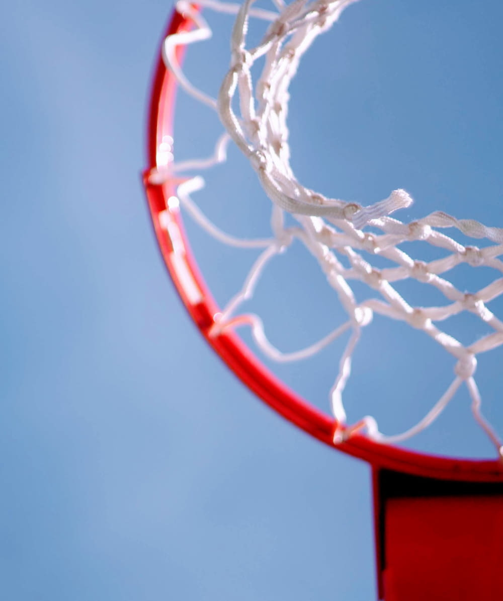 shallow focus photography of red basketball rim
