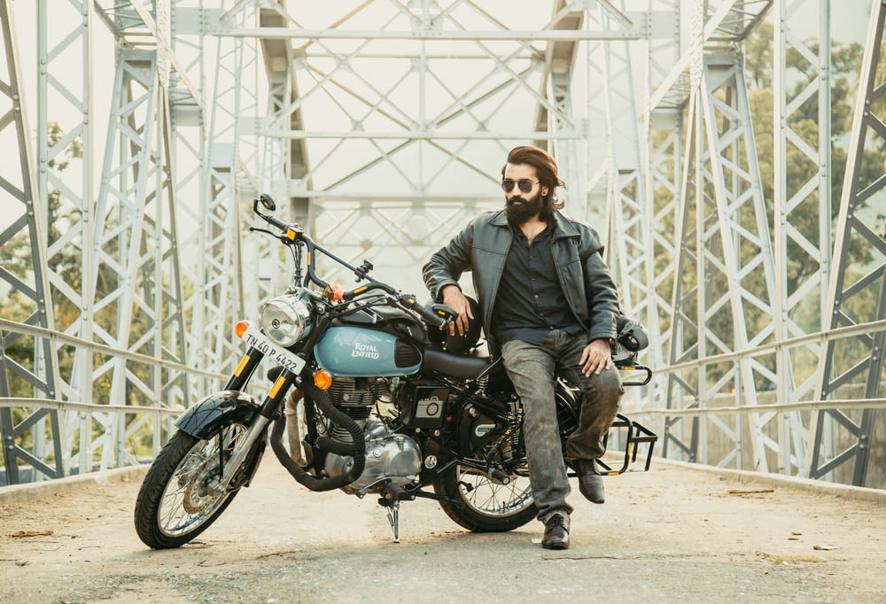 man and a motorbike on a bridge