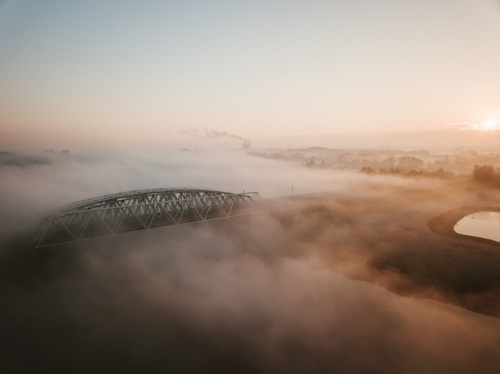 aerial photo of foggy bridge
