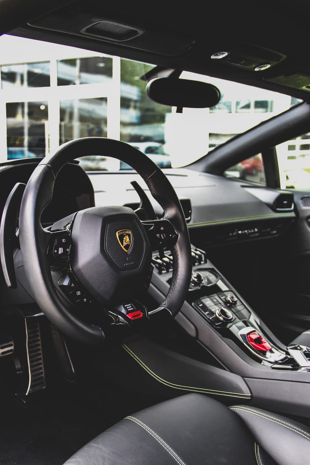black Lamborghini vehicle interior during daytime